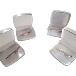 Venta de traba corbatas de vestir en modelos varios para uniformes corporativos, hotelería y gastronomía. Pasadores metálicos elegantes